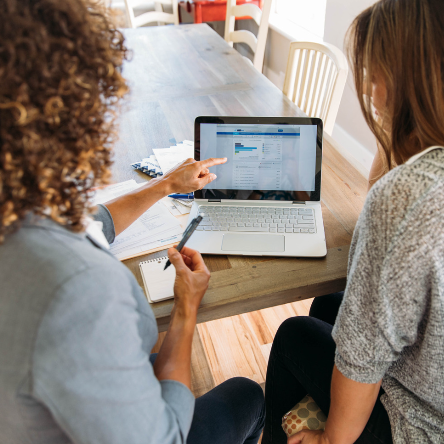 Business owner reviewing financial tech stack tools on a laptop, optimizing bookkeeping, banking, and payments for strategic growth.