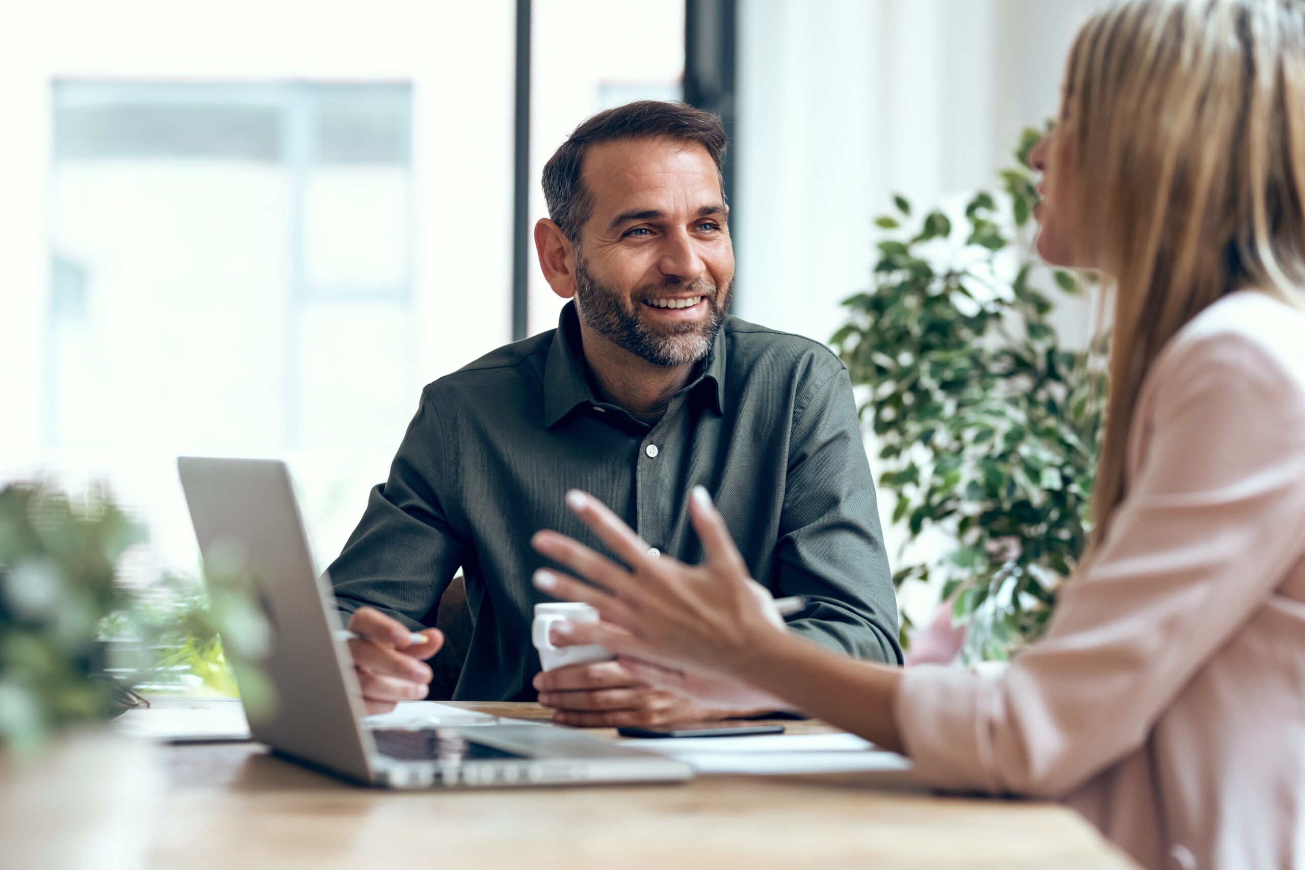 Business owner reviewing financial reports on a laptop using QuickBooks Online, showcasing cloud-based accounting for seamless bookkeeping and financial clarity.